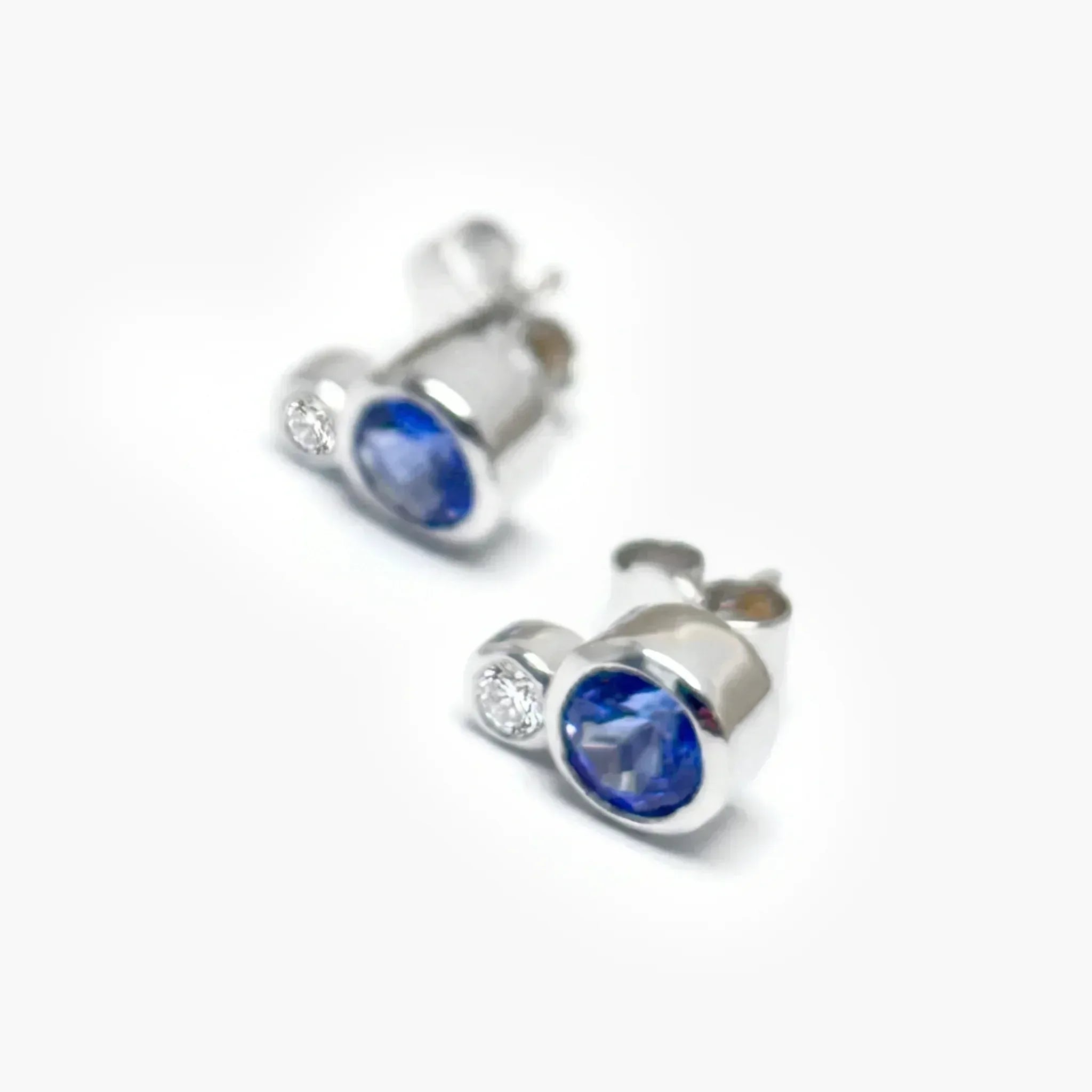 9ct White Gold Tanzanite & Diamond Rubover Stud Earrings - The Jewel House