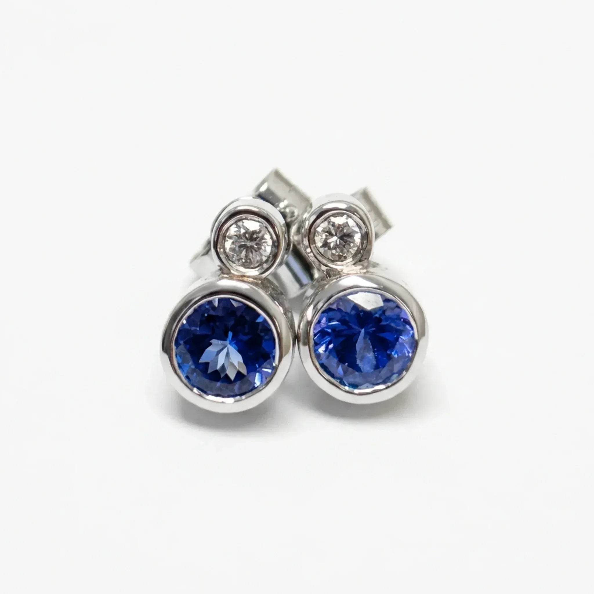 9ct White Gold Tanzanite & Diamond Rubover Stud Earrings - The Jewel House